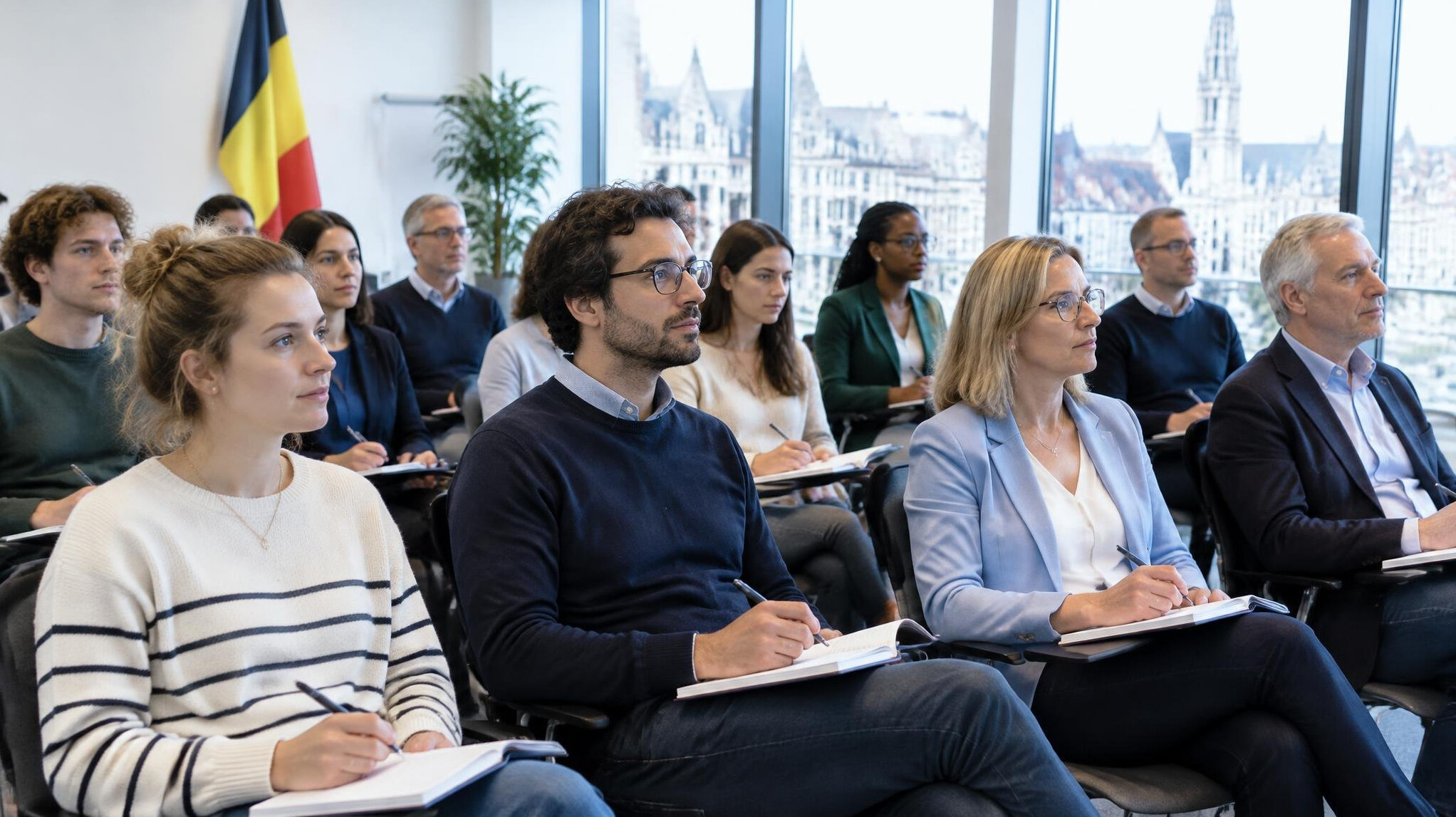 Group of colleagues taking notes during a training session